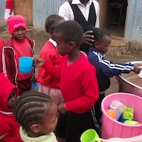 children eating breakfast at Excel Emmanuel School